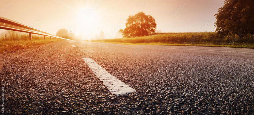 Black Asphalt Road And White Dividing Lines