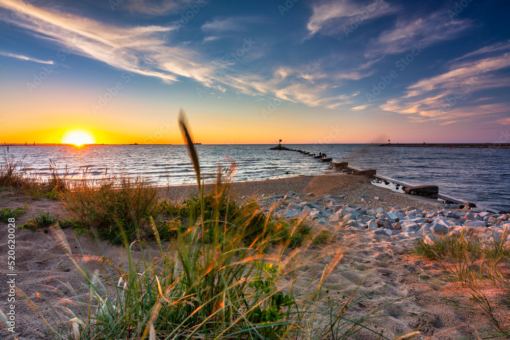 Sunset on the beach of the Baltic Sea in Gdansk, Poland