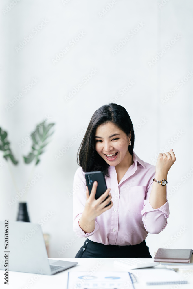 Excited happy business woman looking at phone screen, Cheerful young Asian woman using smartphone an