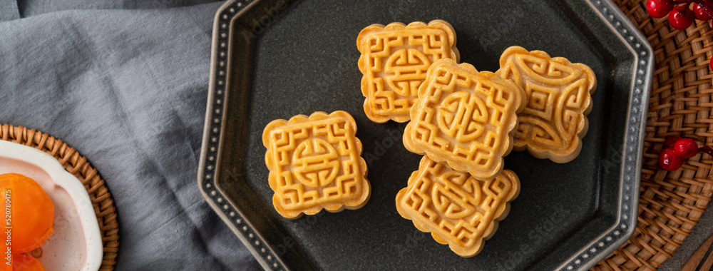 Delicious mung bean moon cake for Mid-Autumn Festival food mooncake on gray table background.