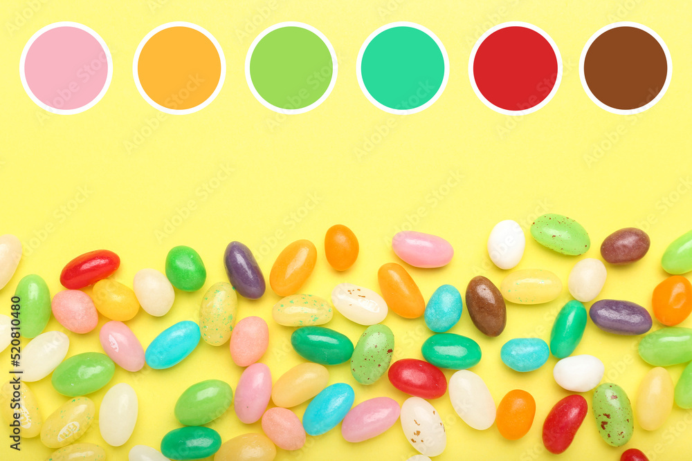 Sweet candies on yellow background. Different color patterns