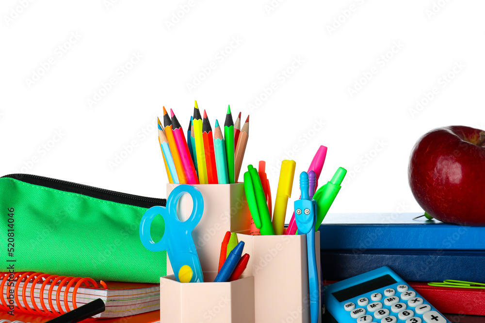 Cup with school stationery, pencil case and apple on white background