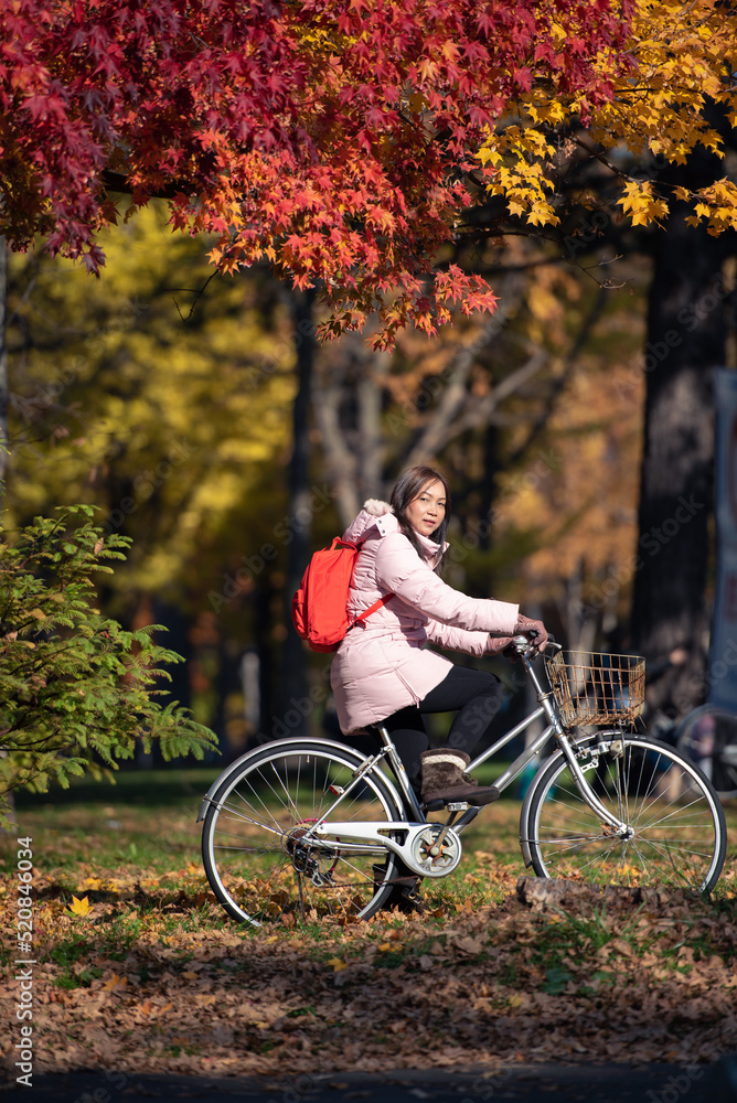 Young healthy Asian woman travel in autumn season, Japan.
