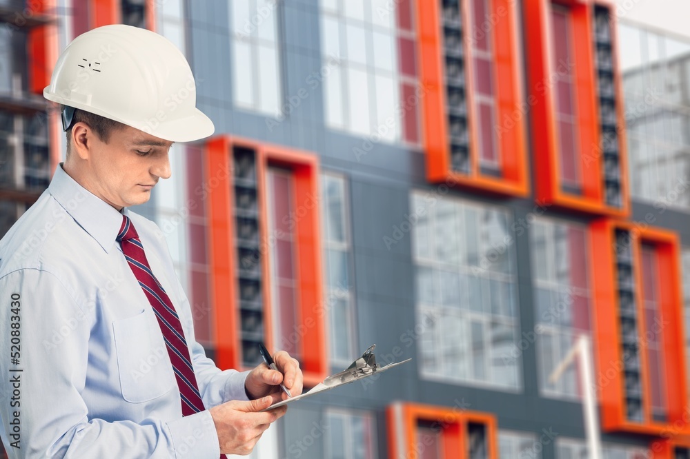 Engineer under checking the industry cooling tower air conditioner of large industrial building to c