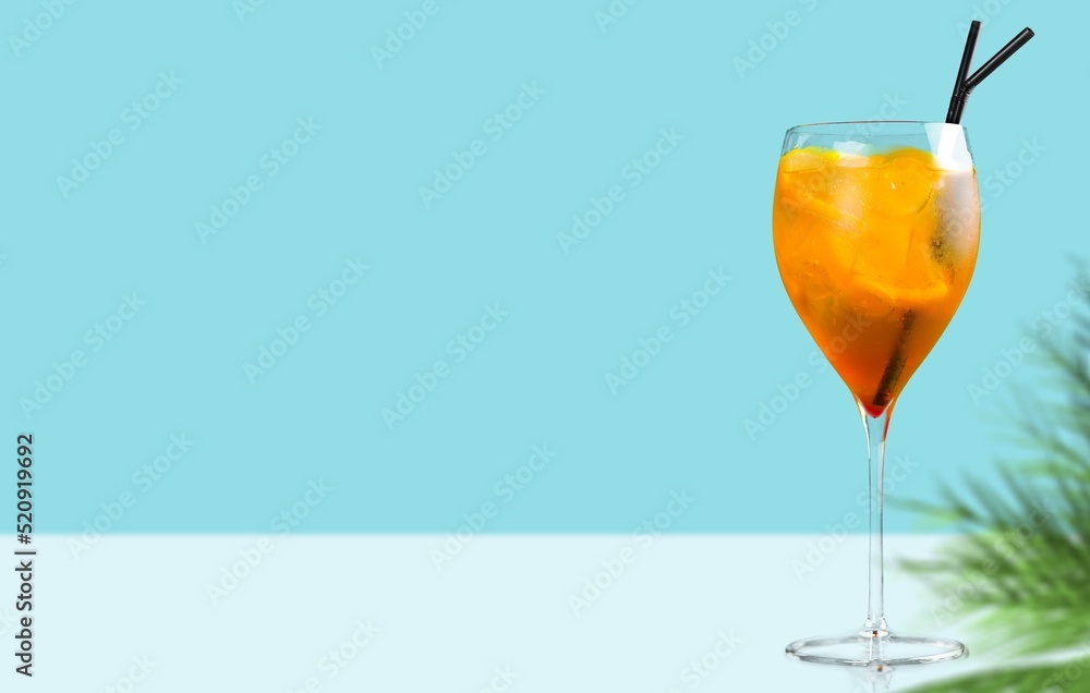 Cold drink with red orange and ice in glass. Refreshing lemonade, summer drink, cocktail, soda.