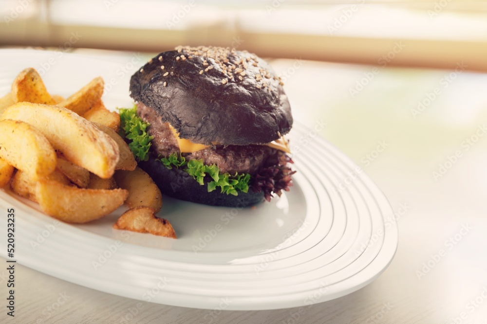 Tasty fresh fast food with French Fries on a plate