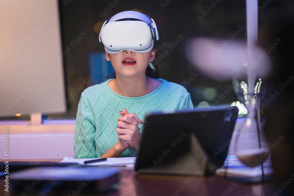 Creative Asian Young female woman wearing smart virtual  glasses and joining business meeting on aug