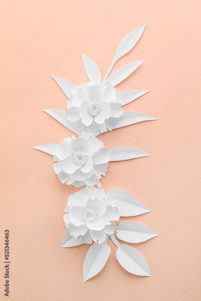 Composition with beautiful paper flowers and leaves on pink background