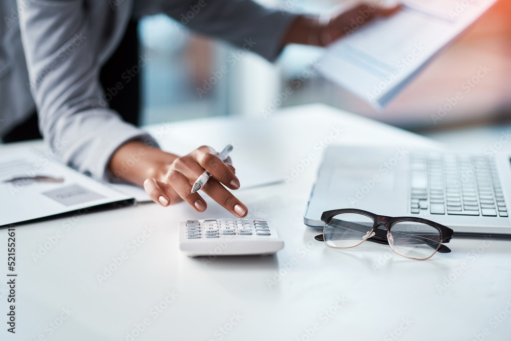 Accountant, businesswoman or banker using calculator, checking paperwork and documents while prepari