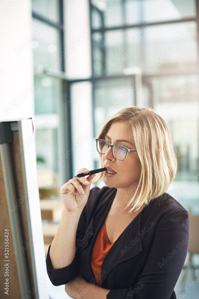 Business woman working, thinking and brainstorming alone on a white board for a meeting. Office empl