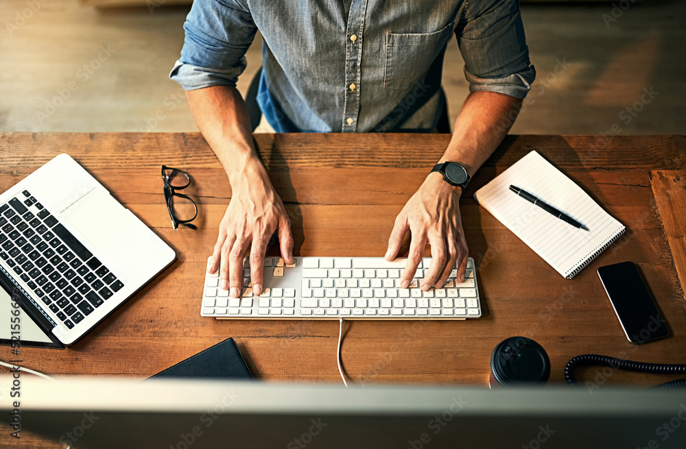 Busy businessman typing on computer keyboard with hands late at night while working, planning and ch