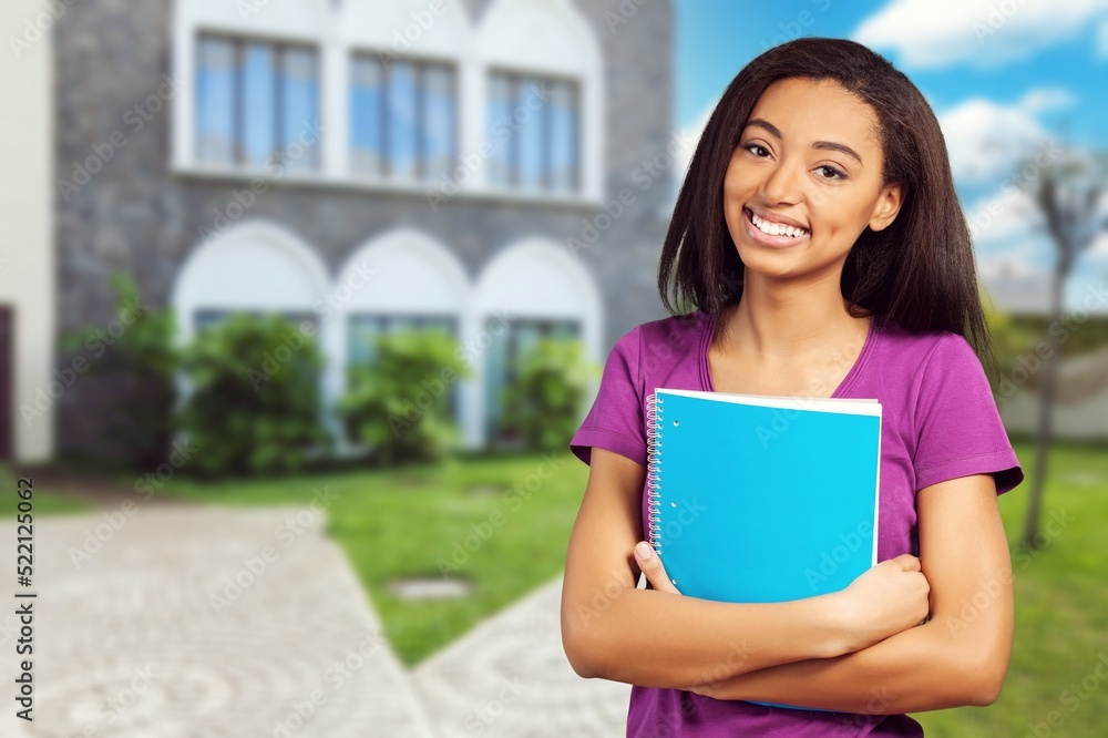 Happy student woman smiling looking at camera