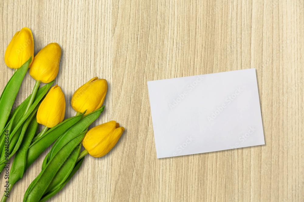 Motivational quote concept with white paper with flower on wooden table background