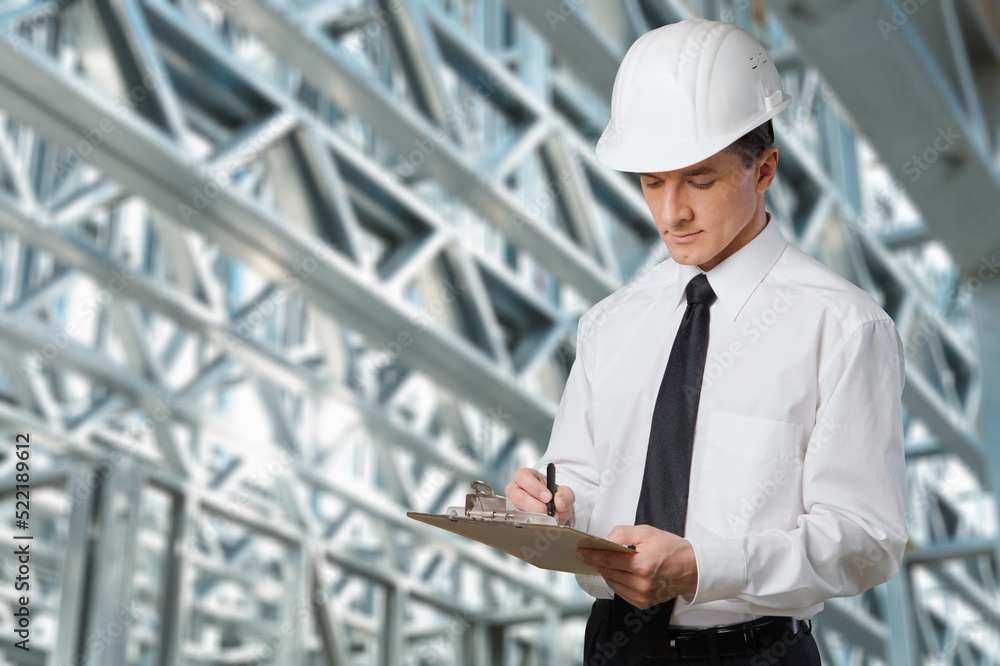 Engineer under checking the industry cooling tower air conditioner of large industrial building to c