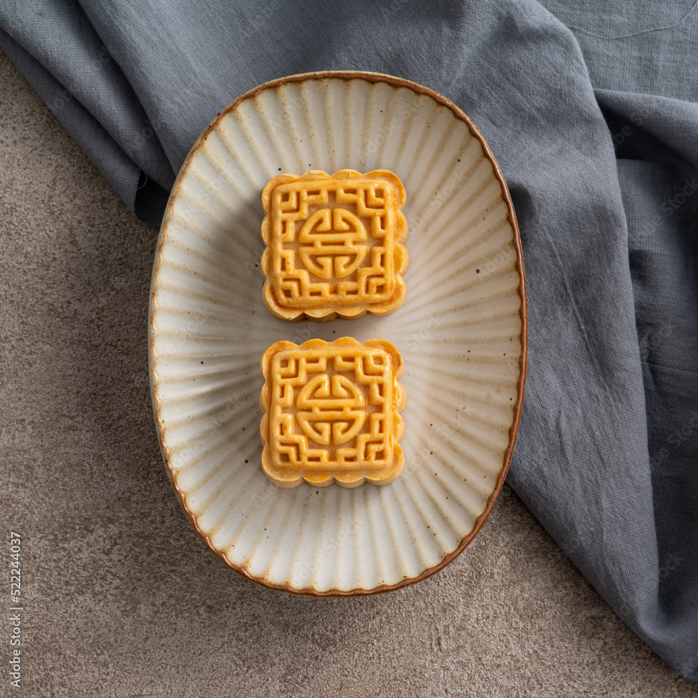 Delicious mung bean moon cake for Mid-Autumn Festival food mooncake on gray table background.