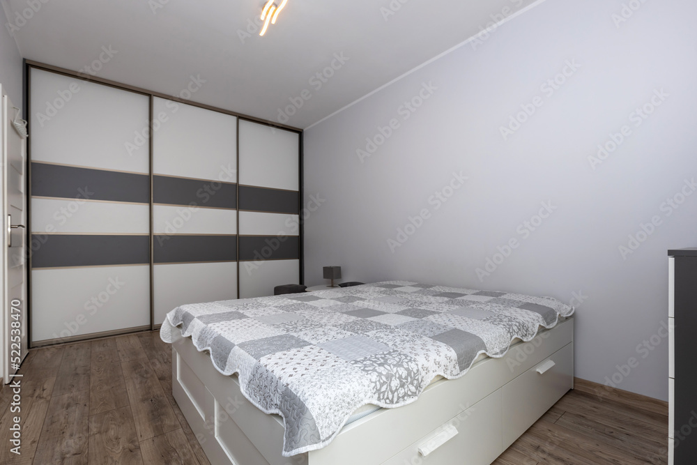 Master bedroom in gray and white colors