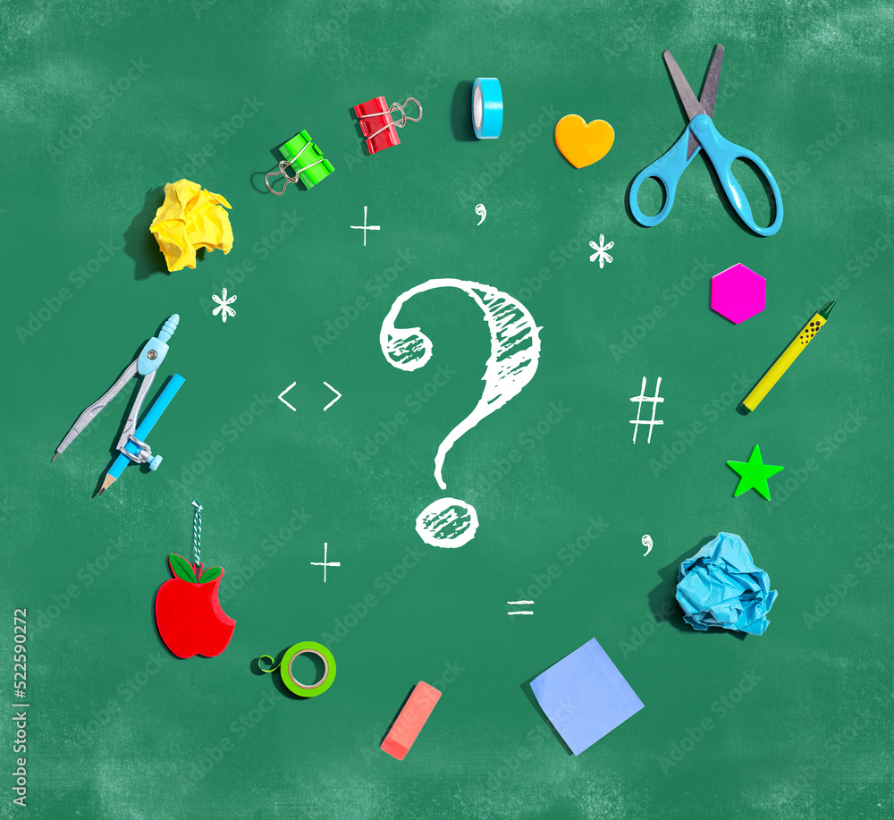 Question mark with school supplies on a chalkboard - flat lay