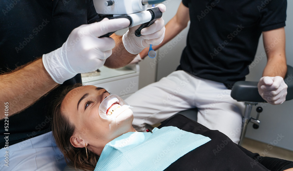 Dental specialist examining patient teeth. Stomatology modern teeth healthcare treating.