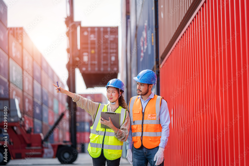 Foreman man and worker working checking at Container cargo,Logistics import export shipping concept.