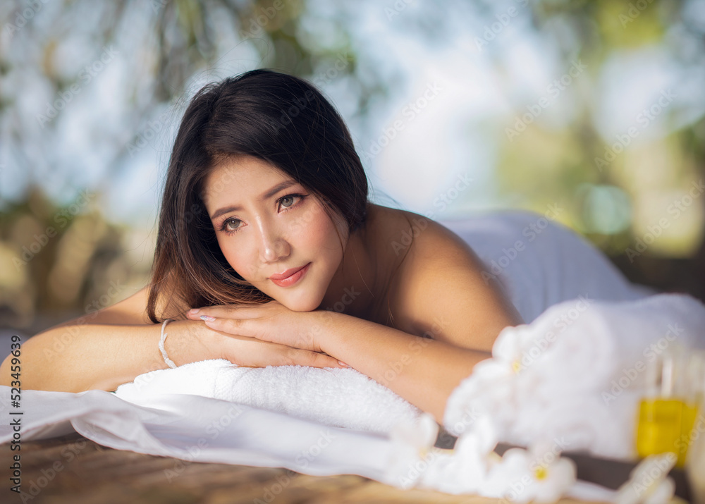 Asian woman relax with body spa in resort