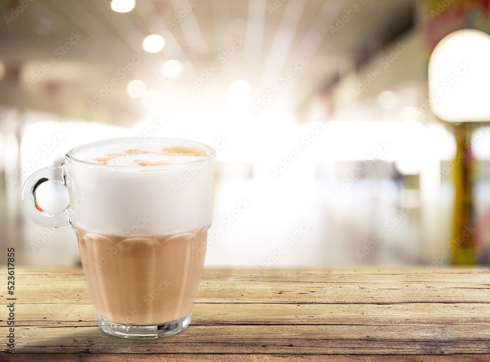 Tasty aroma coffee in a glass cup on the desk