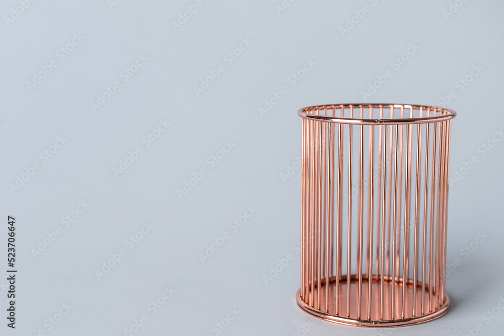 Pink pen cup on grey background