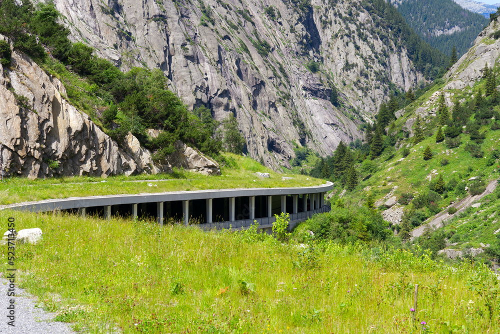 Scenic landscape with avalanche protection gallery of Swiss mountain pass road at Schöllenen Gorge o