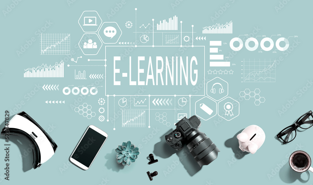 E-Learning theme with electronic gadgets and office supplies - flat lay