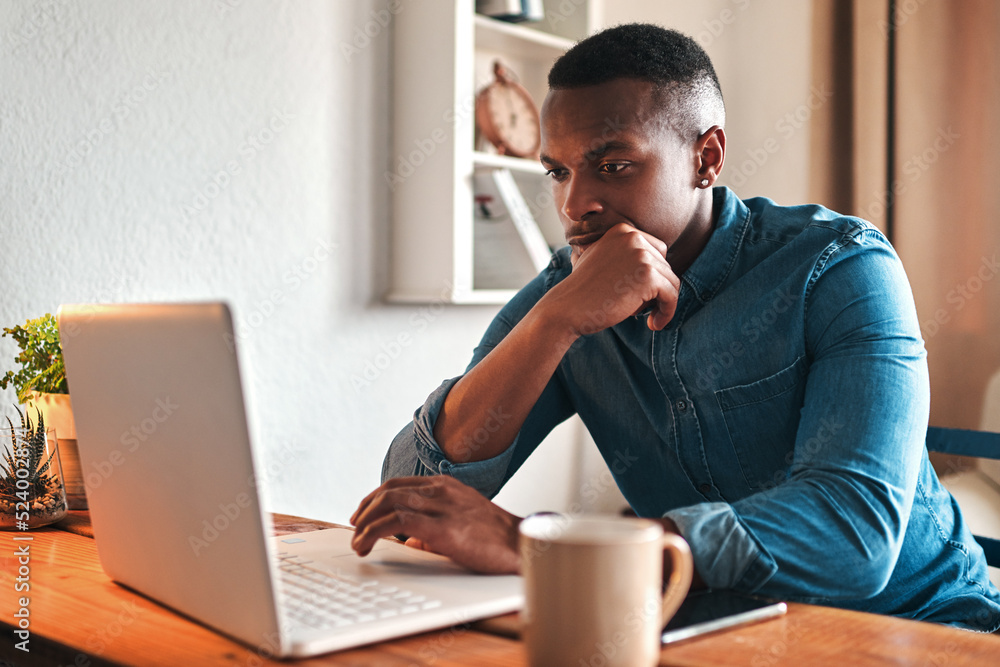 Man thinking, typing and working on a laptop remote for a social media startup content writing busin