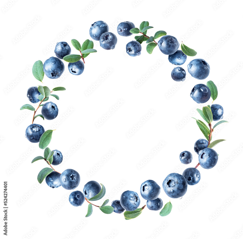 Blueberries in water drops arranged in a circle with green leaves