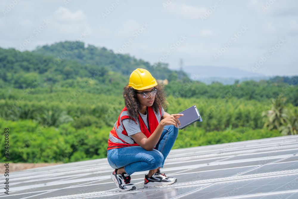 Technician checking solar panels on factory roof,Environment friendly, Green energy,Ecological,Using