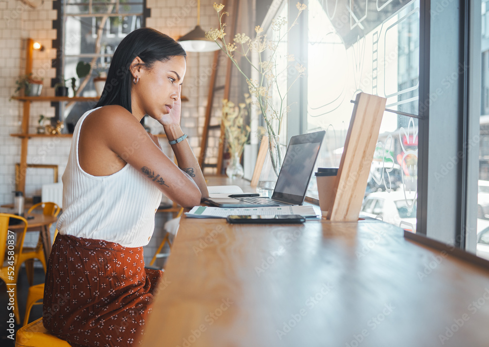 Stressed, thinking and working woman on a laptop at a cafe, watching a video or receiving bad news o