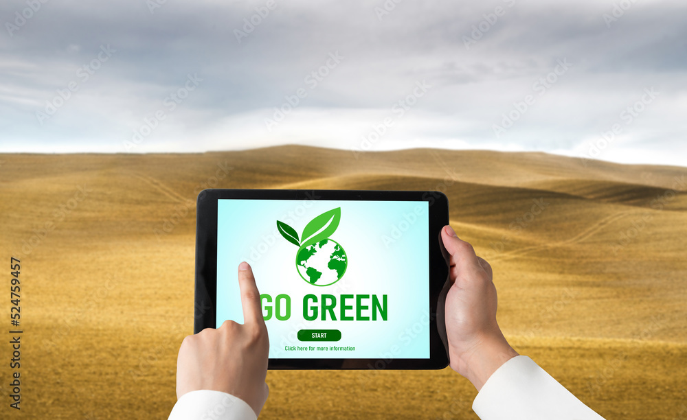 Green business transformation for environment saving and ESG business concept. Businessman using tab