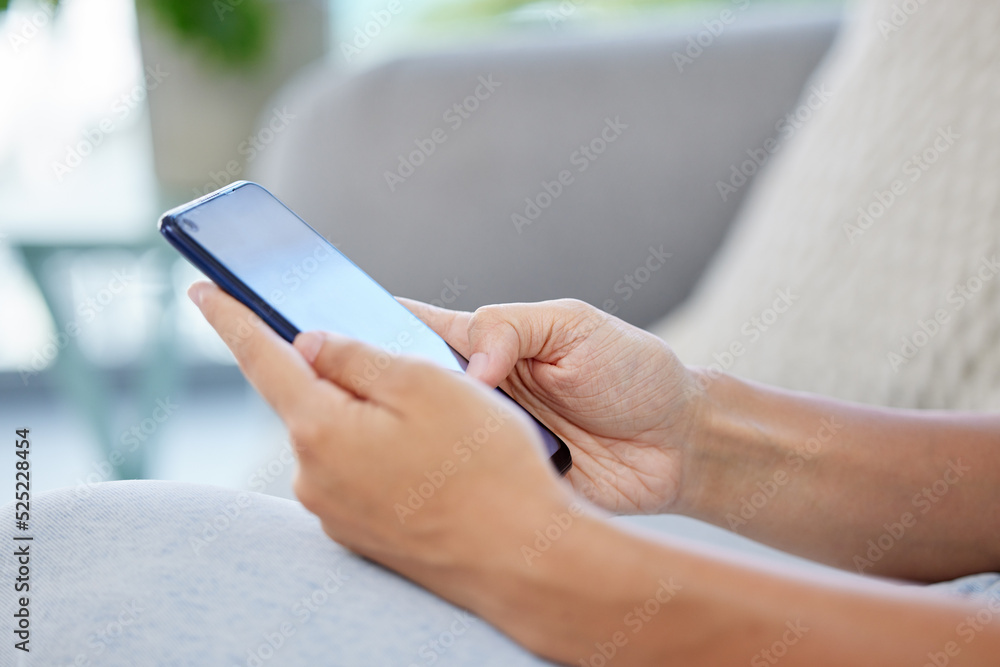 Social media, online shopping and surfing the internet, woman on a phone on a sofa. Communication, c