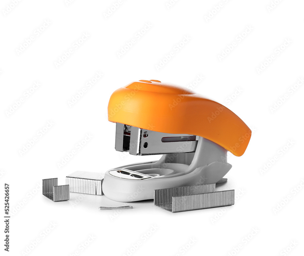 Orange stapler with staples on white background