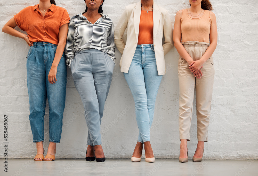 Creative and stylish team of business women against wall together, doing teamwork and collaboration 