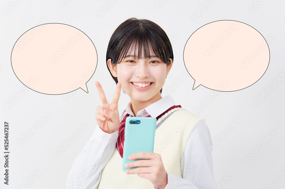 白背景でスマホを持ってピースサインする女子高生　吹き出しあり