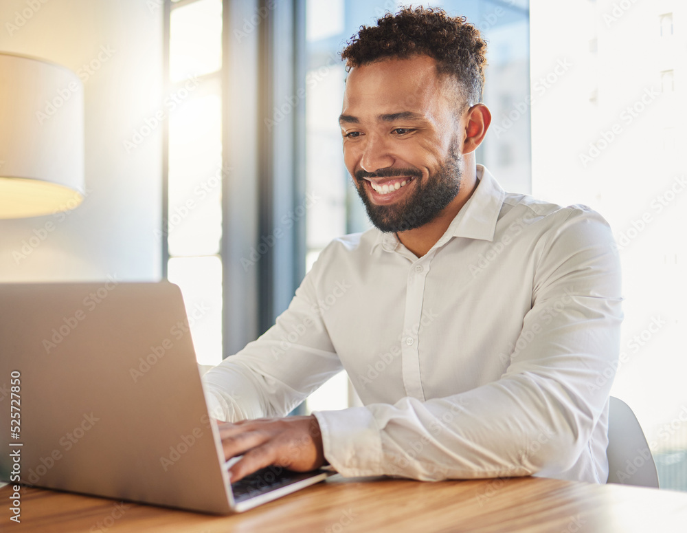 Happy business manager on laptop typing an email announcement for success or project management stra