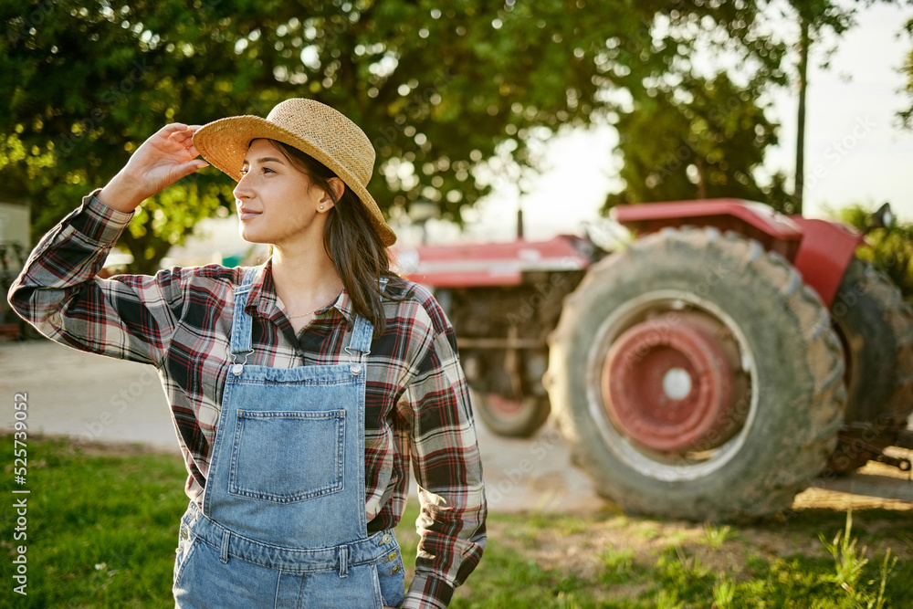 Farm, tractor and a woman in a hat in nature or field farming food, fruits and vegetables. Agricultu