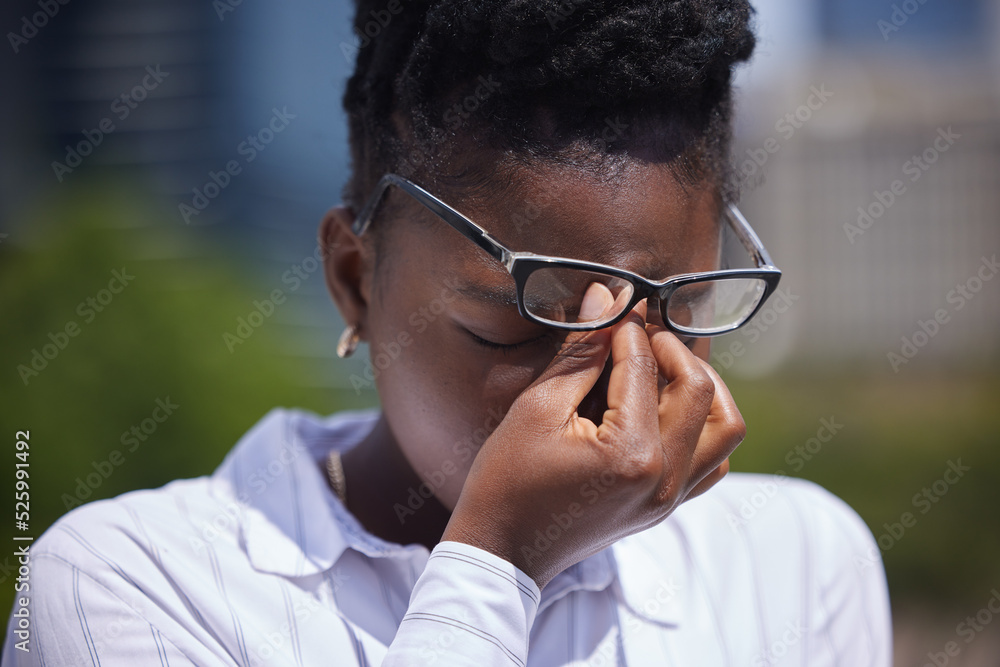 Headache, stress or mental health and a frustrated or sad black woman with depression outside. Anxie