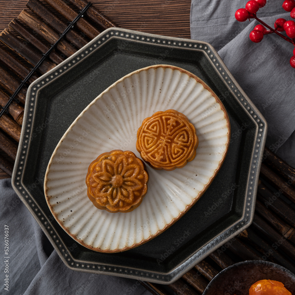 Delicious Cantonese moon cake for Mid-Autumn Festival food mooncake on wooden table background.