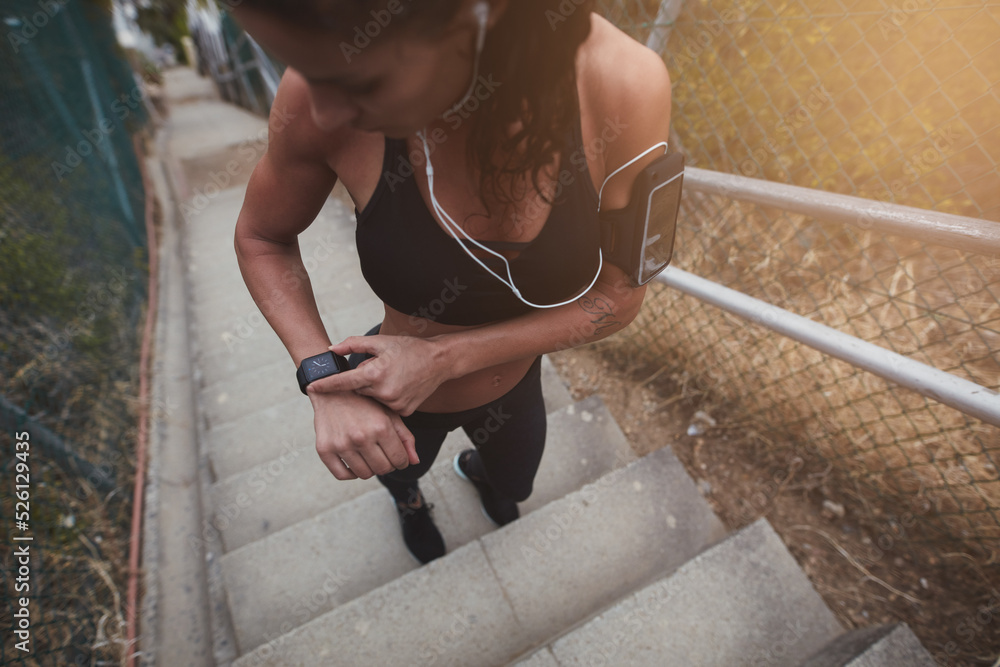 Sportswoman checking the time on a smartwatch