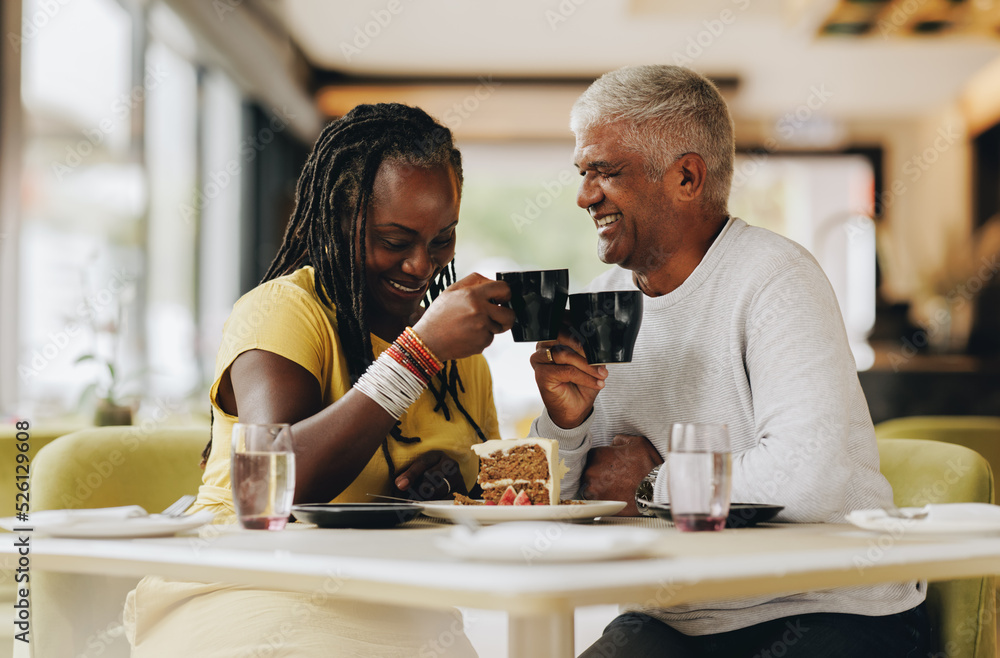 Senior couple enjoying themselves in a coffee shop