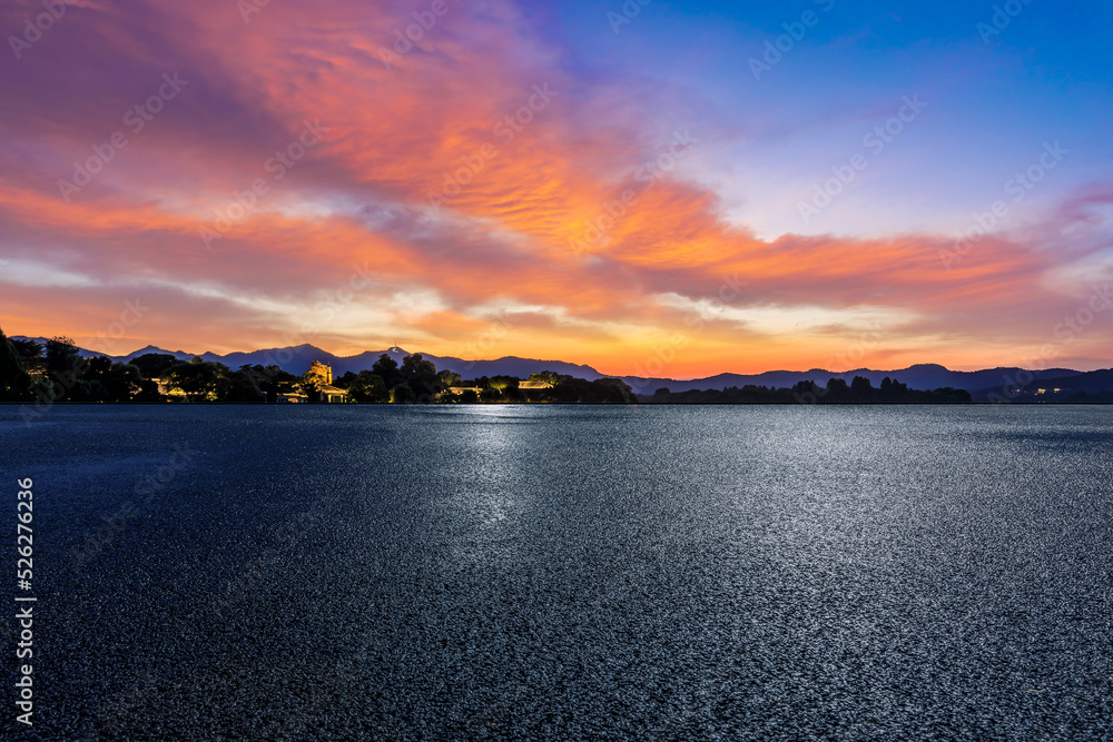 Empty asphalt road and mountain with beautiful sky clouds at sunset