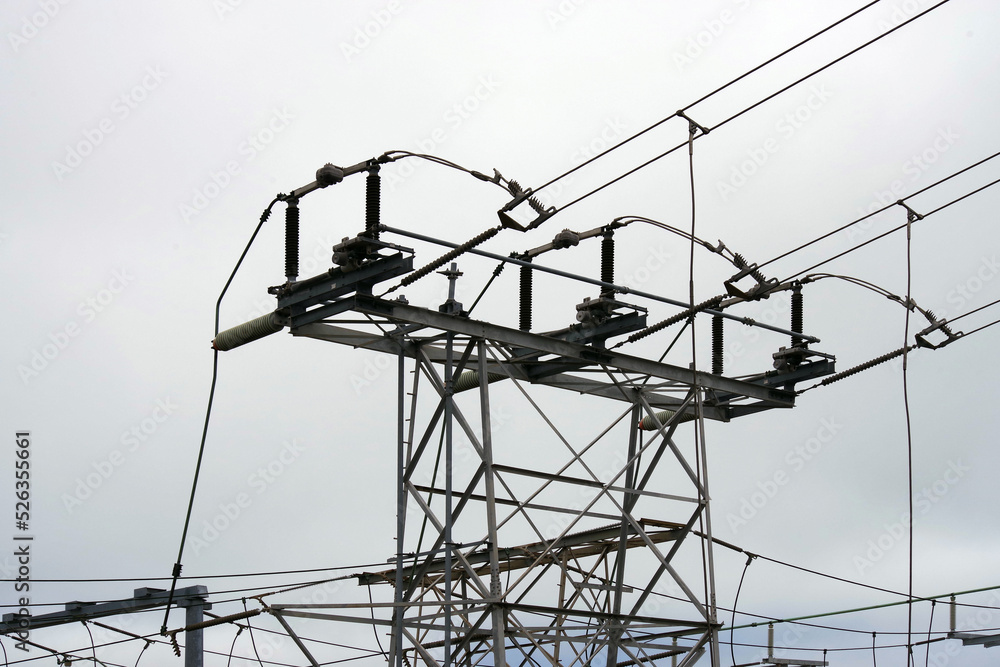 Electricity station with power lines under a gray cloudy sky