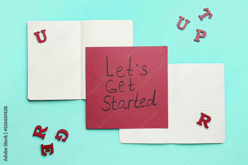 Paper sheet with text LETS GET STARTED, letters and notebooks on turquoise background