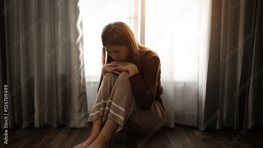 woman sit Depression Standing by window and anxiety Copy space. .