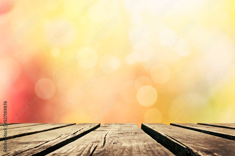 Wooden table with autumn leaves background, Multicolored leafs in sunny fall afternoon 