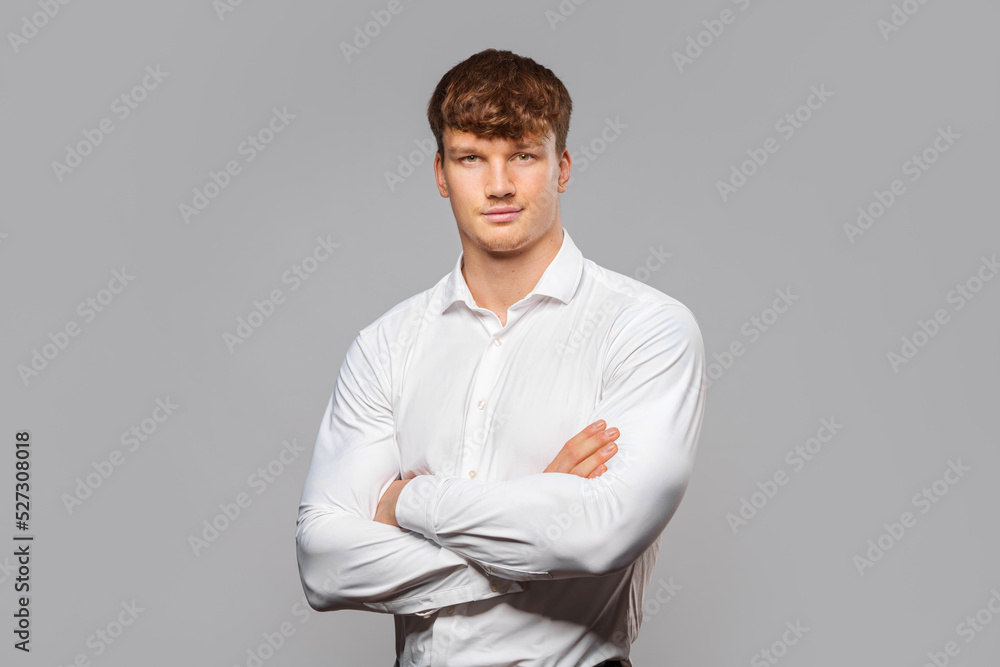 a young, educated, muscular man in a shirt. Strength. Success businessman concept.