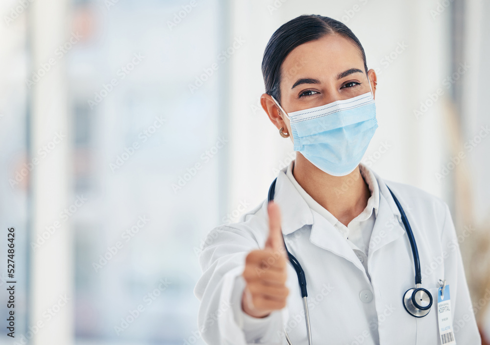 Thumbs up, mask portrait and doctor in agreement with healthcare procedure at hospital. Woman medica